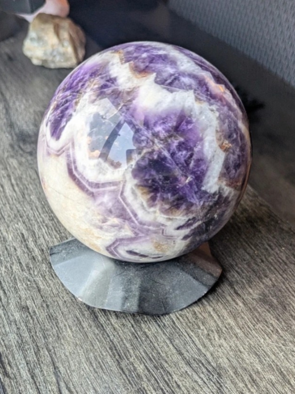 3" Diameter Natural Chevron Amethyst Crystal Sphere. Comes with black stand